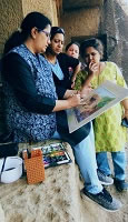 Chitra Vaidya doing final touches to the painting